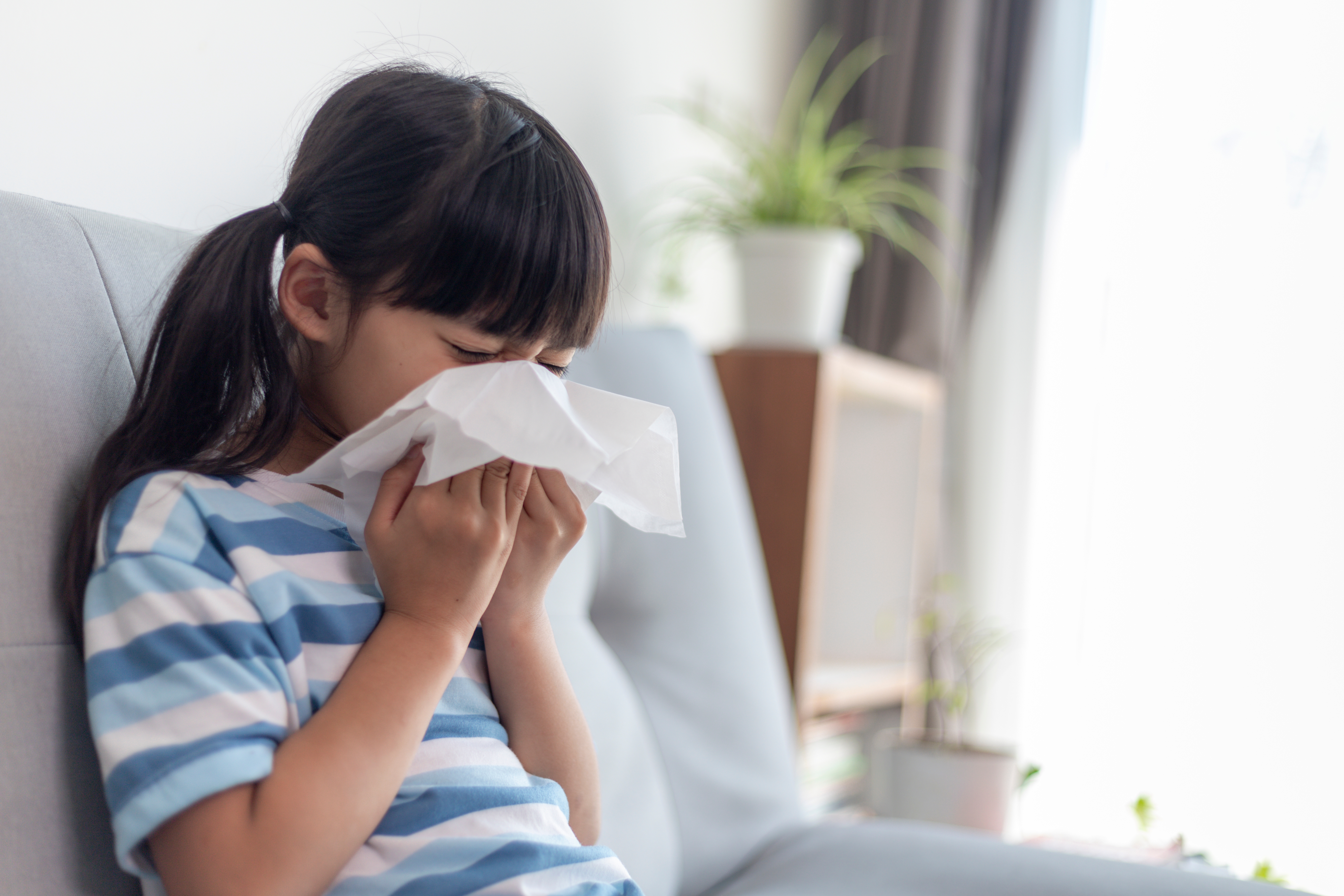 girl sneezing